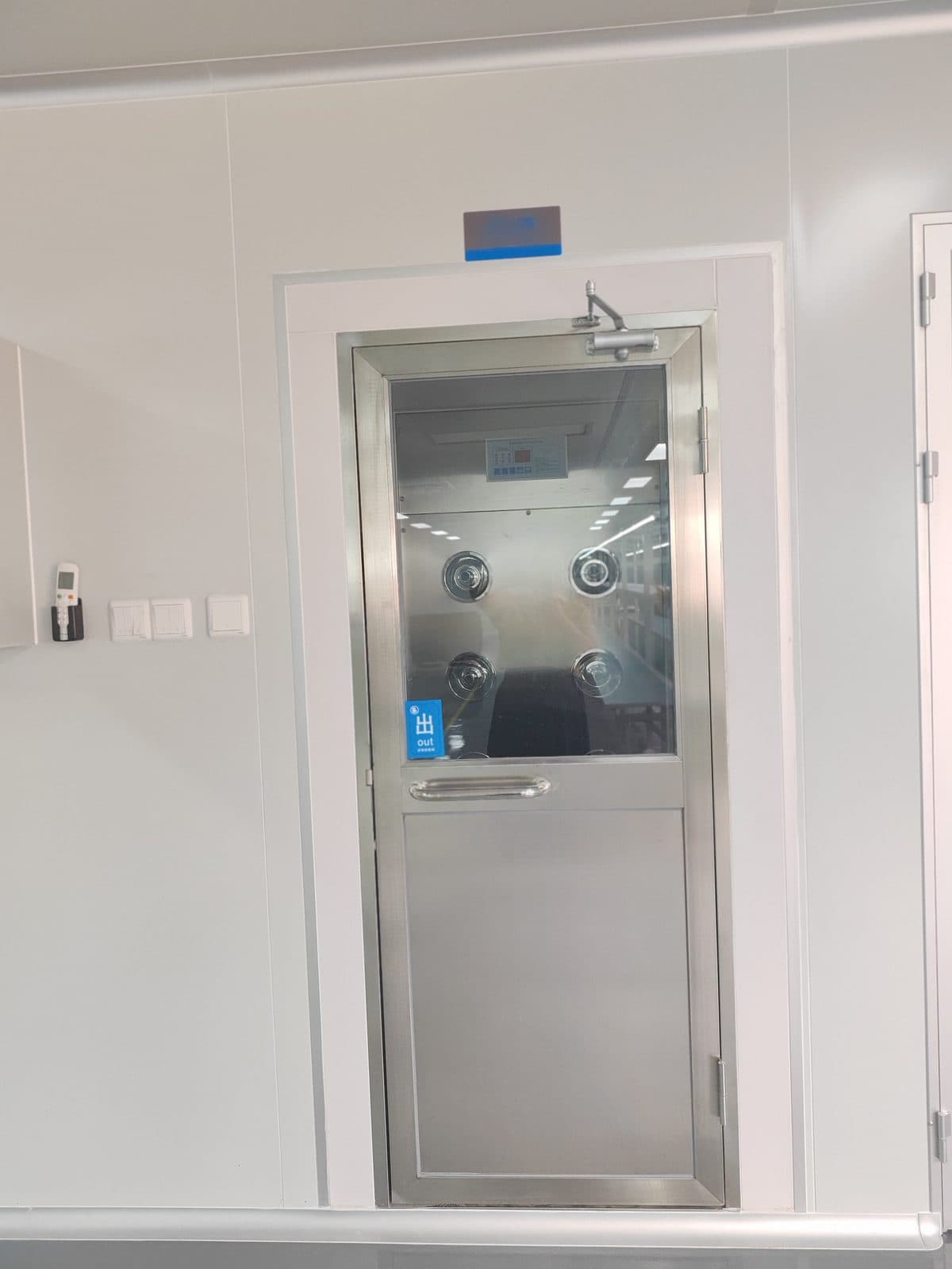 Stainless-steel air shower at the entrance to SiLeap's controlled-environment assembly area