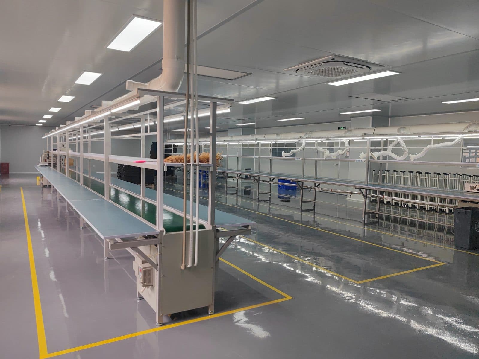 Wide view of a bright, clean baby nasal aspirator assembly line at the SiLeap factory